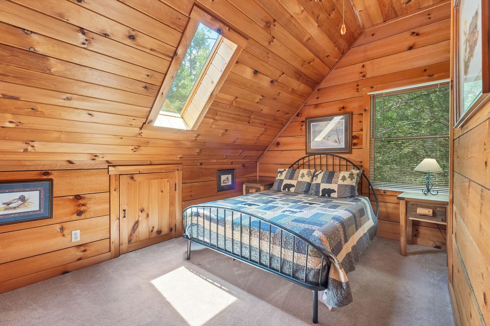 Upstairs private bedroom with a queen size bed.