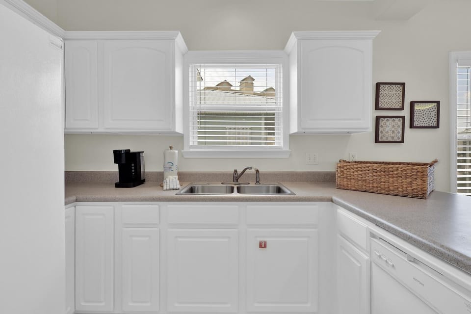 Kitchen - The fully stocked kitchen offers both small and large appliances, and is fully stocked with dishes and cookware.
