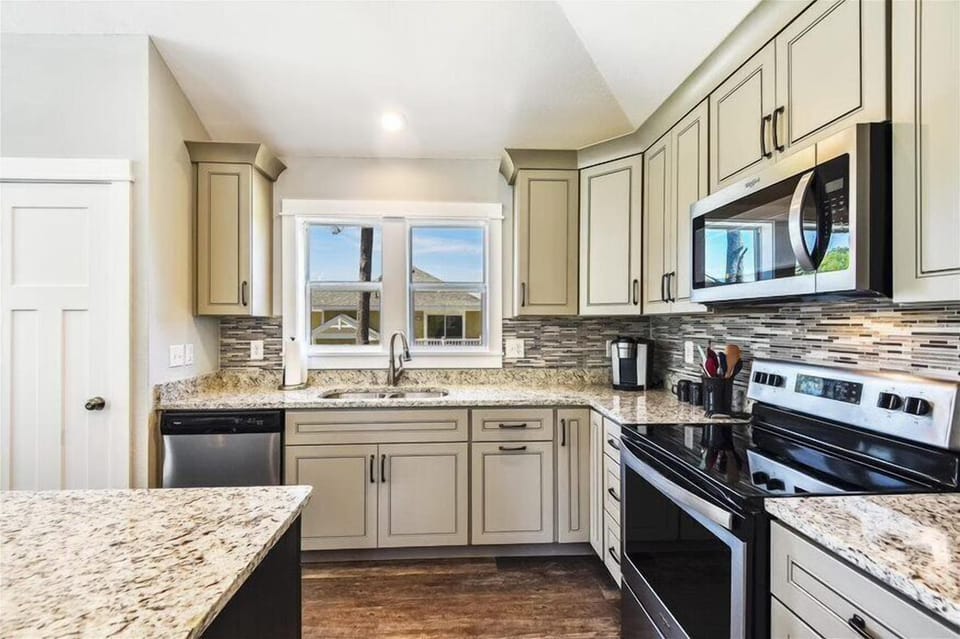 An off-white themed kitchen that blends elegance and culinary creativity seamlessly.