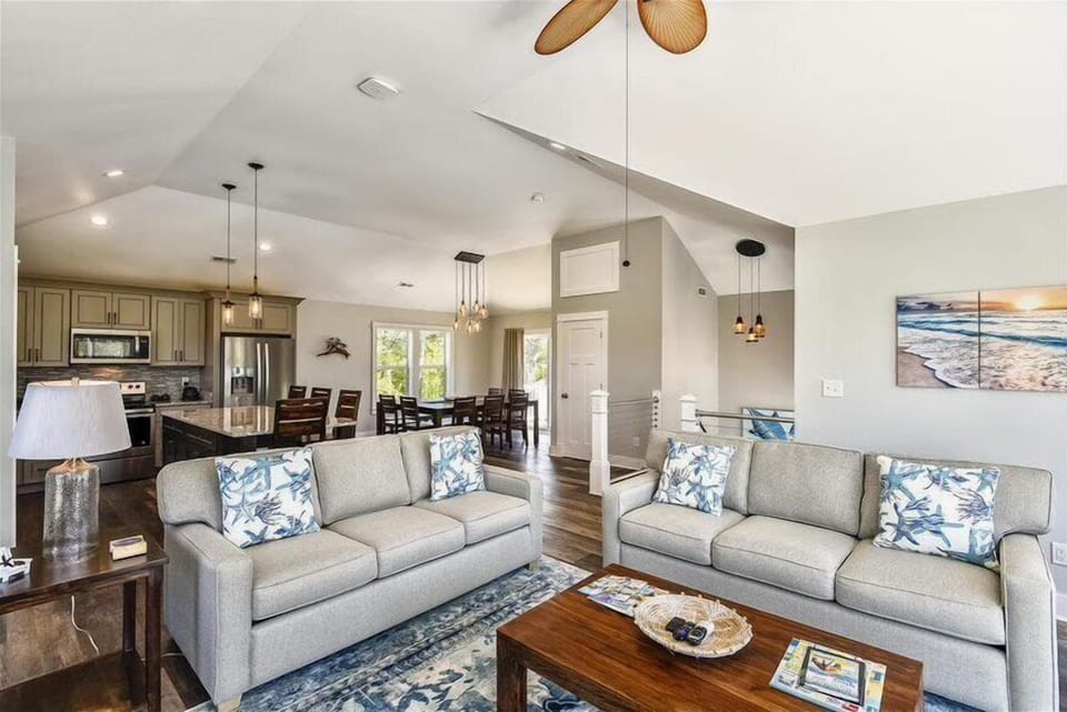 White Harmony: A Living Room and Kitchen Unite in Serene Elegance.