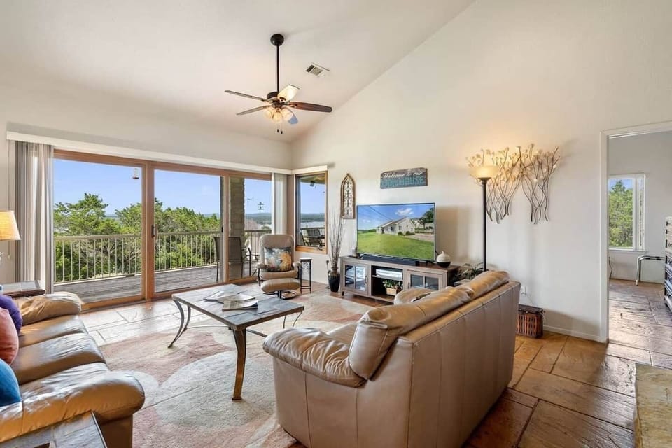 Relax in the open living room with breathtaking lake views.