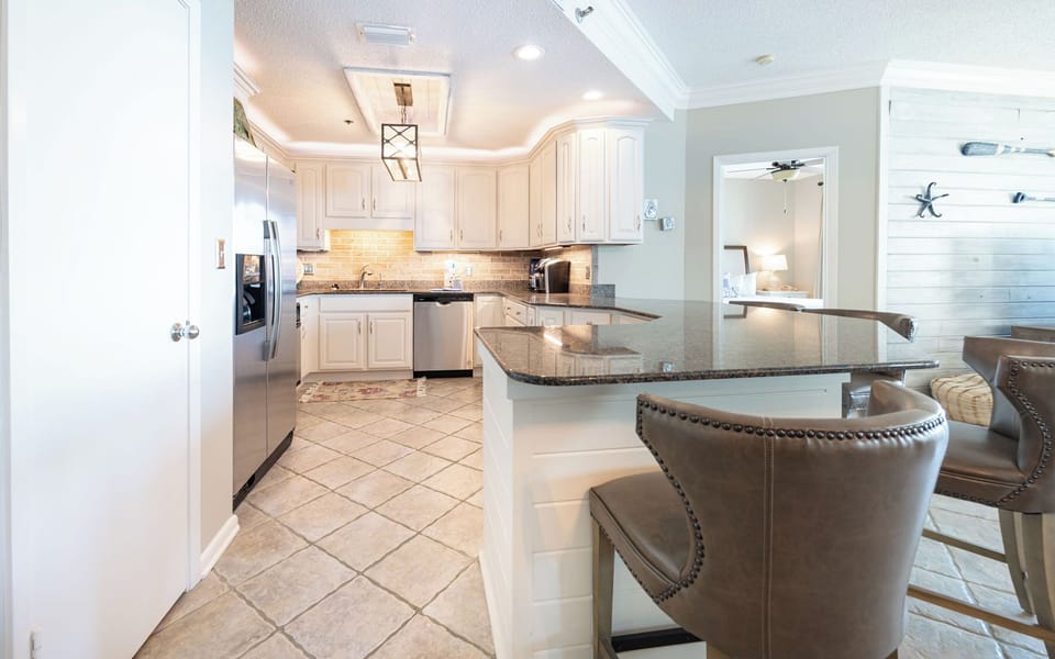 Enjoy crafting your favorite meals with loved ones in this inviting kitchen, complete with modern appliances