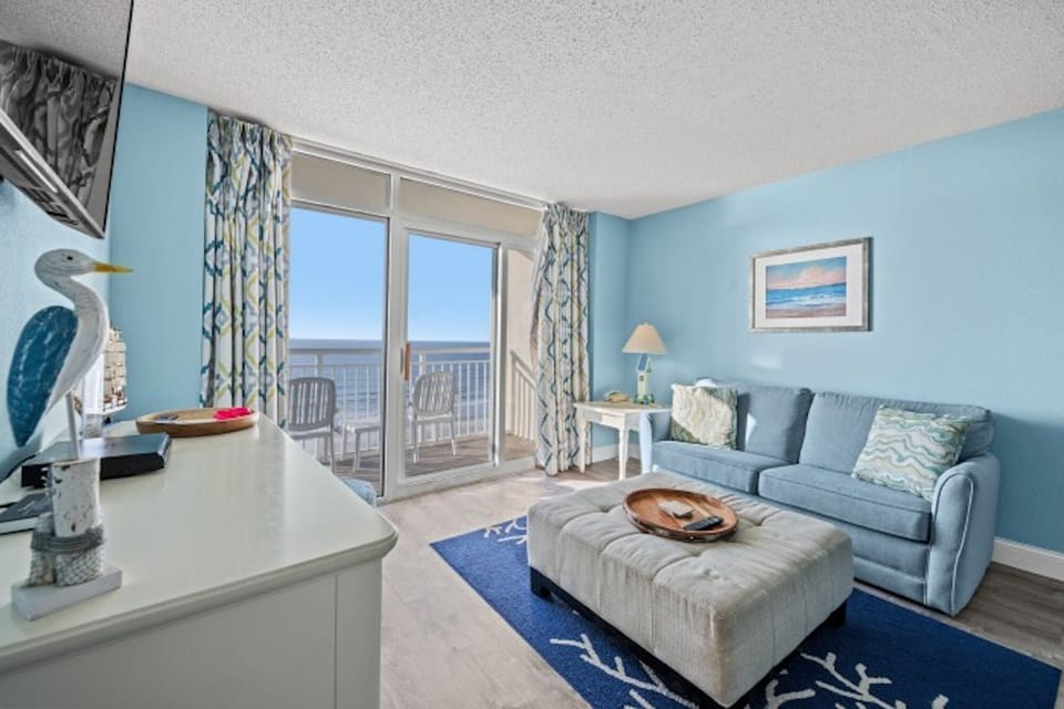 The ocean front living room is well-appointed with comfortable furnishings.