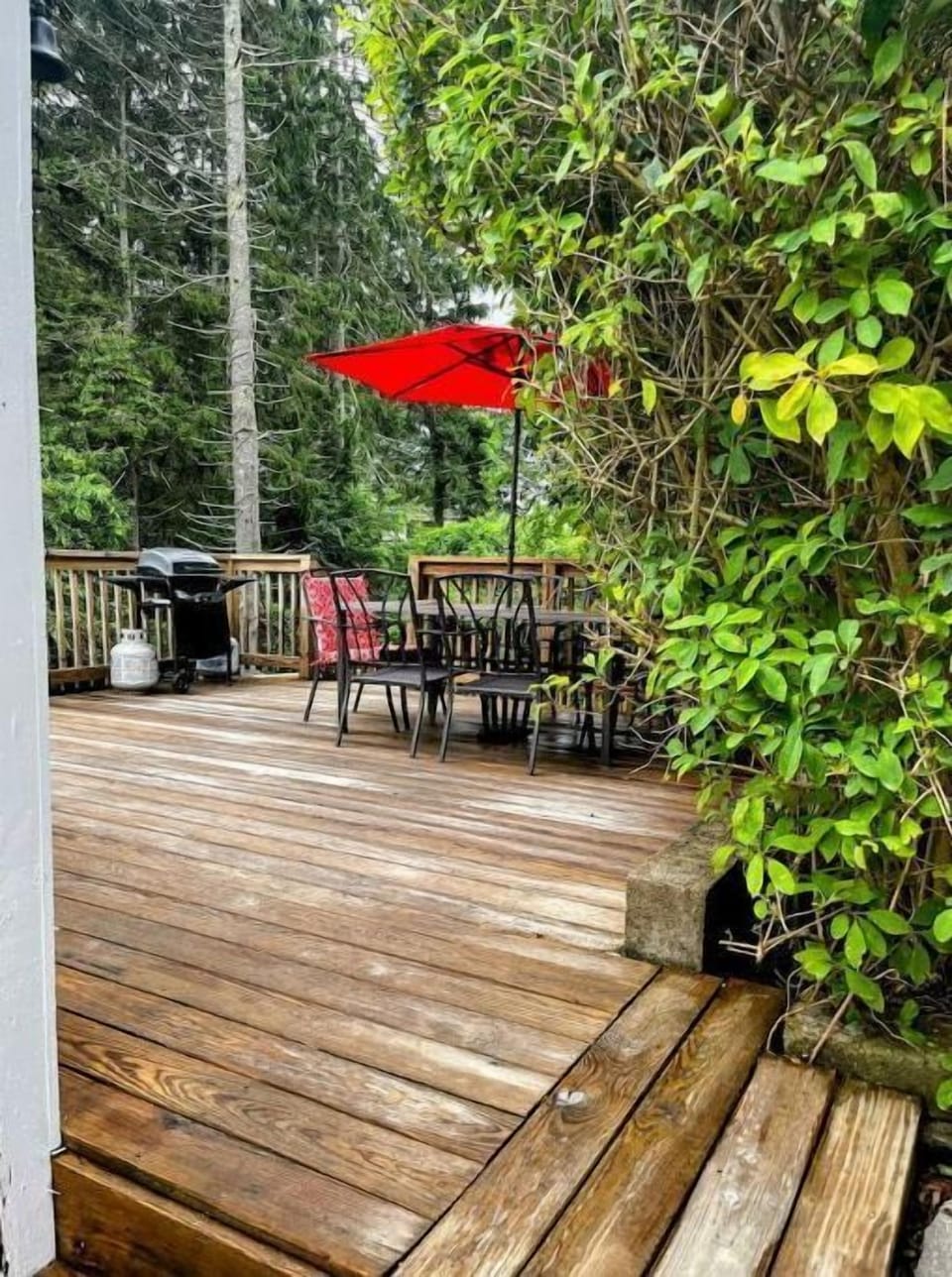 Large deck for entertaining, grilling, umbrella and storage bin w/ beach chairs.