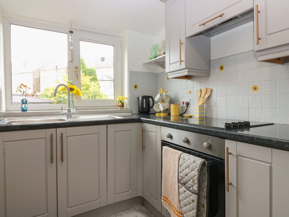 Fridge, electric kettle, toaster, cookware/dishes/utensils