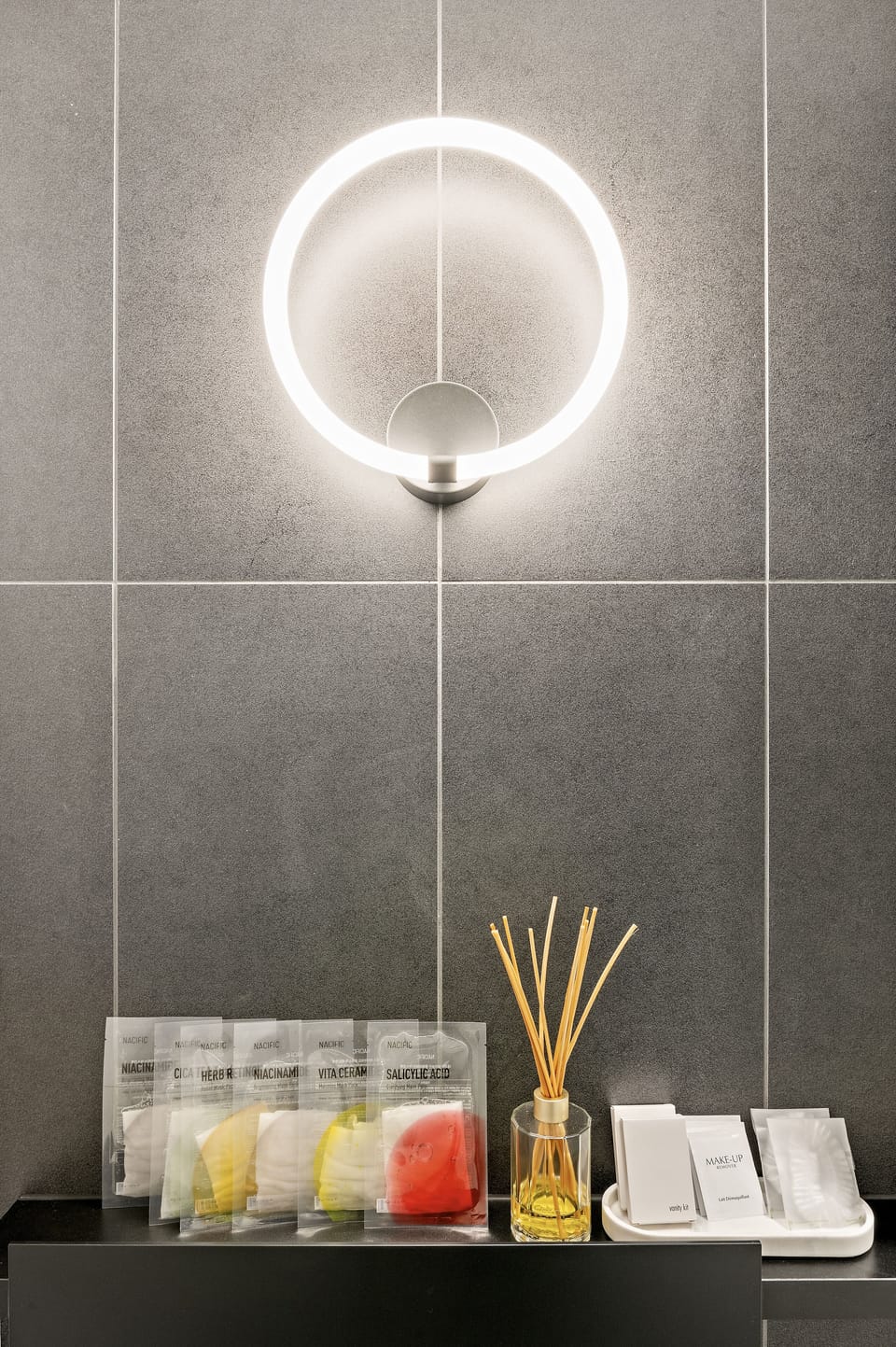 Bathroom equipped with facial masks, vanity kits, makeup removal and shower caps