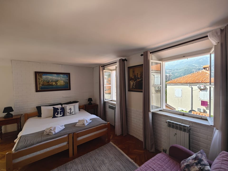 Family Studio, City View | In-room safe, soundproofing, iron/ironing board, free WiFi