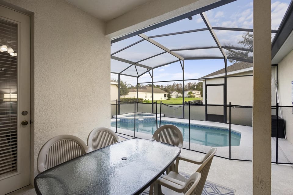 Delight in poolside dining within the comfort of our screened lanai, blending indoor comfort with outdoor charm.