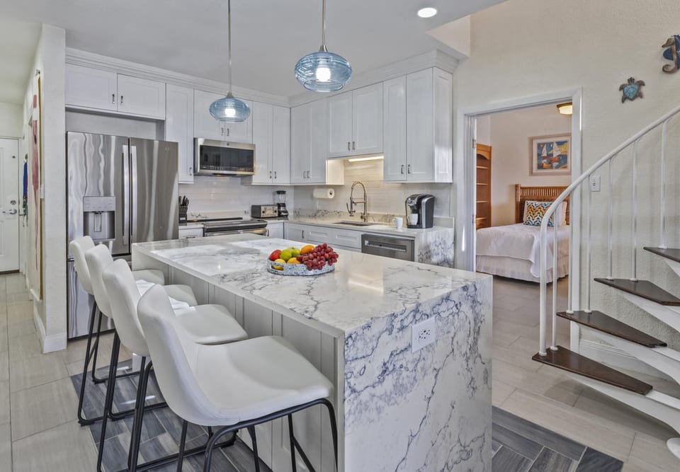 Modern kitchen with marble island and sleek stainless appliances