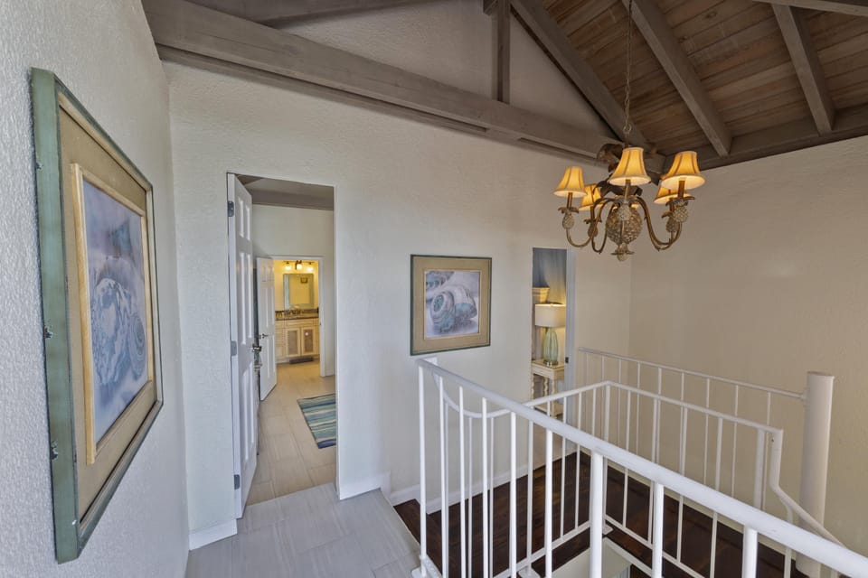 Charming upstairs landing closes off loft bedroom for privacy