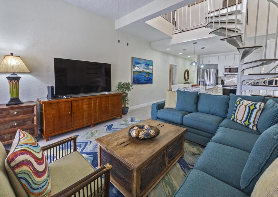 Cozy living room with vibrant seating and coastal charm