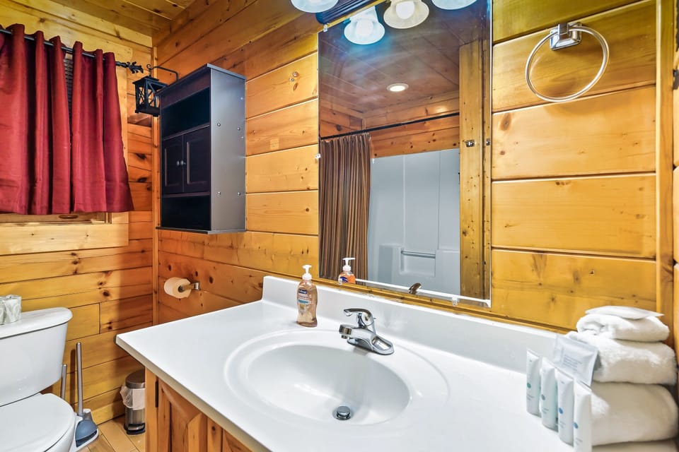 Full size bathroom on main floor, conveniently next to guest bedroom & gameroom