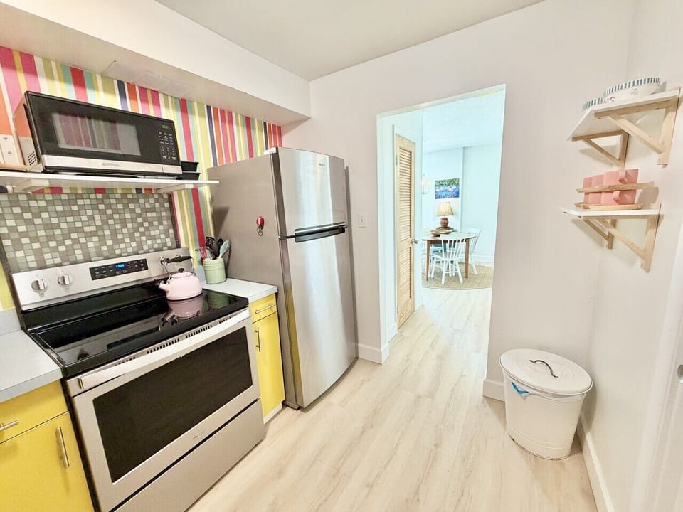 Colorful kitchen stocked for your stay