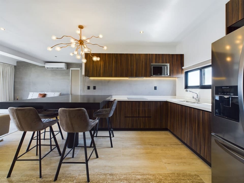 Modern kitchen and dining area with all you need to cook and gather.