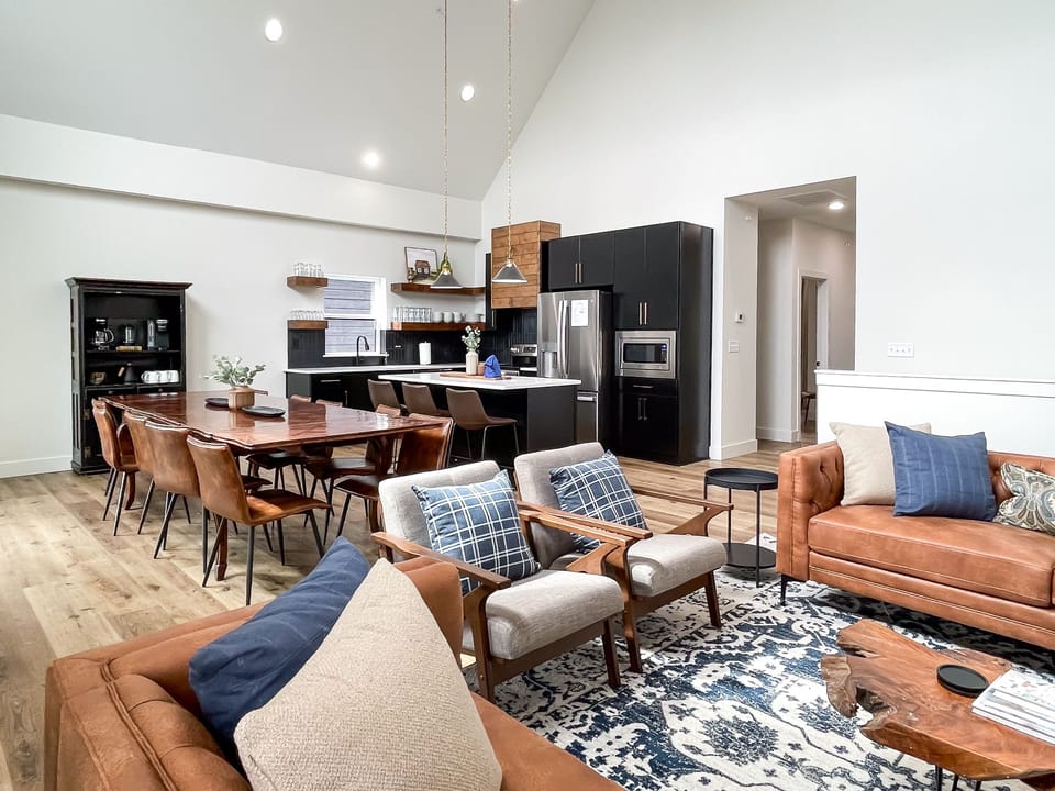 Open concept bright and airy great room, dining and kitchen.
