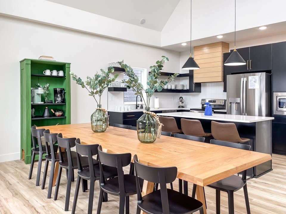 Main level open concept dining and kitchen with abundant seating