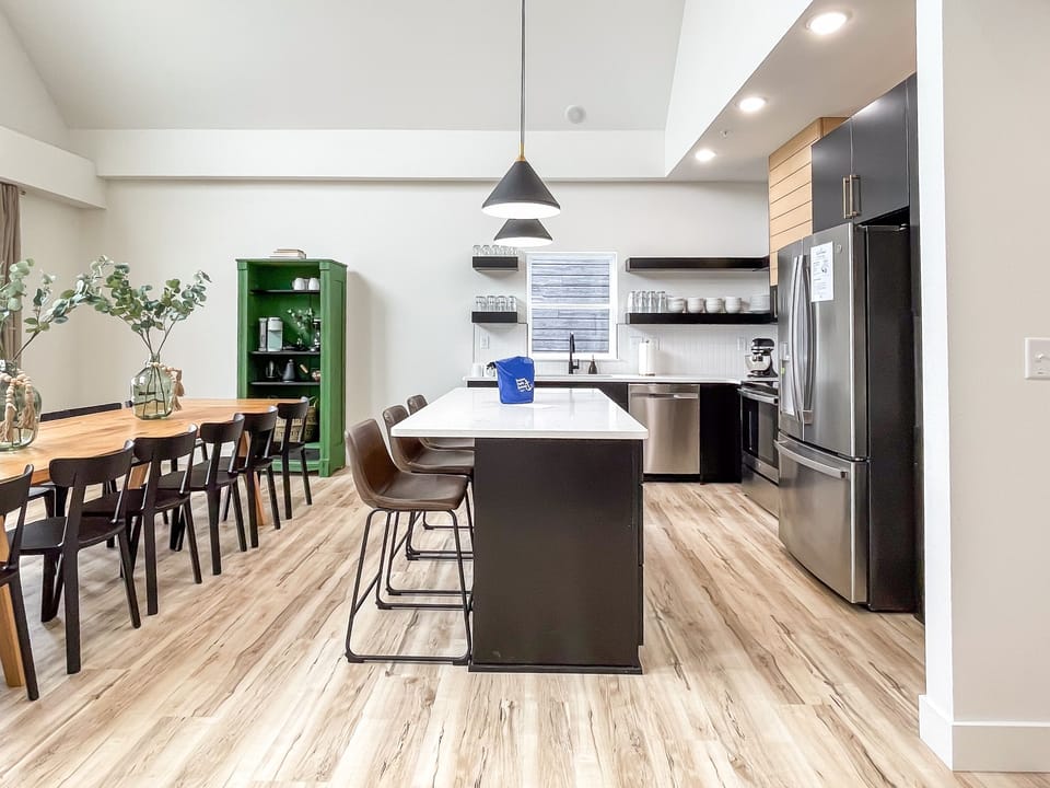 Main level open concept dining and kitchen with abundant seating