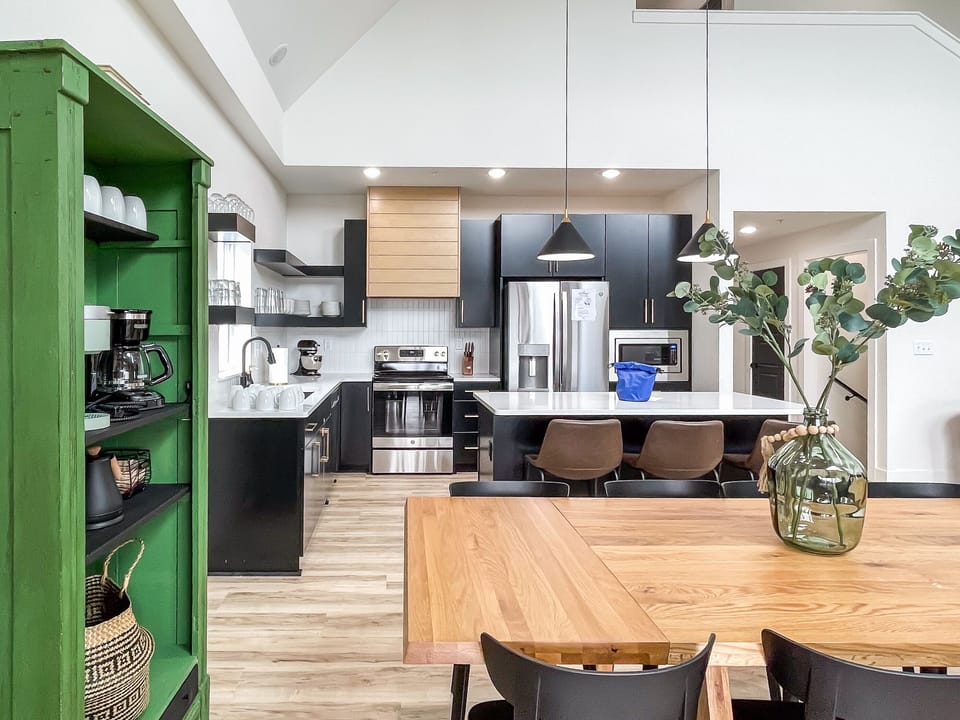 Main level open concept dining and kitchen with abundant seating