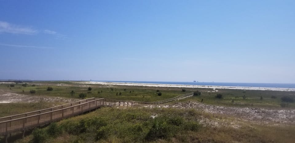 view of boardwalk & ocean