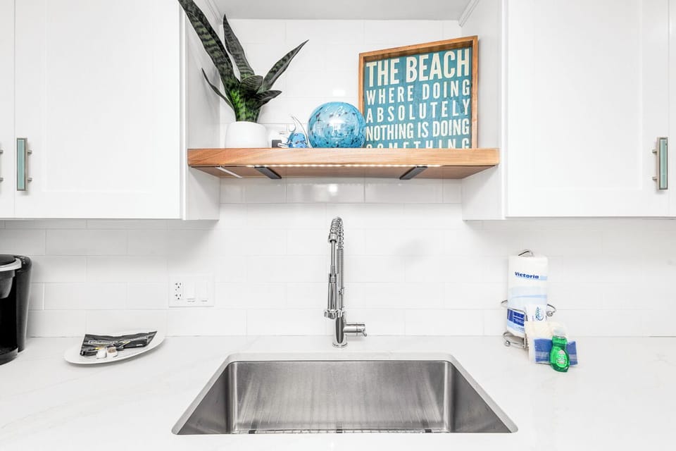 You'll love preparing meals in this bright kitchen with coastal charm and thoughtful details.