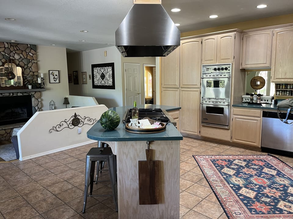 Open concept gourmet kitchen with Viking appliances and view of mountains always