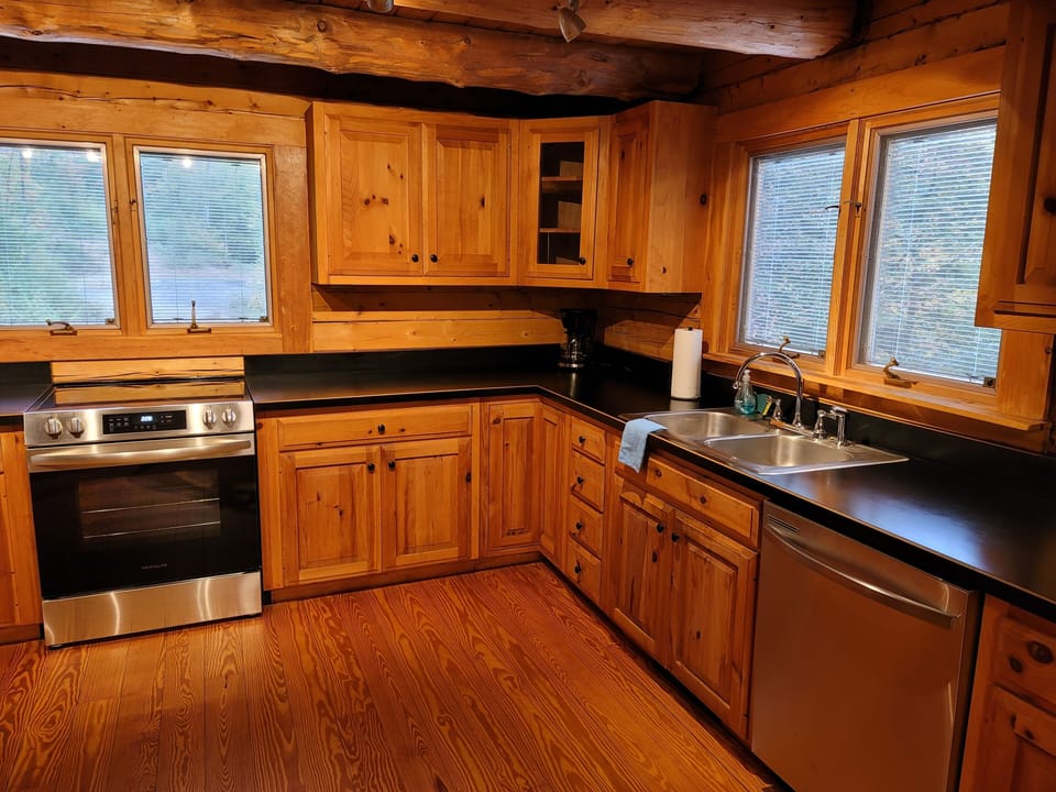Large kitchen, with gleaming new appliances provides space for multiple cooks.