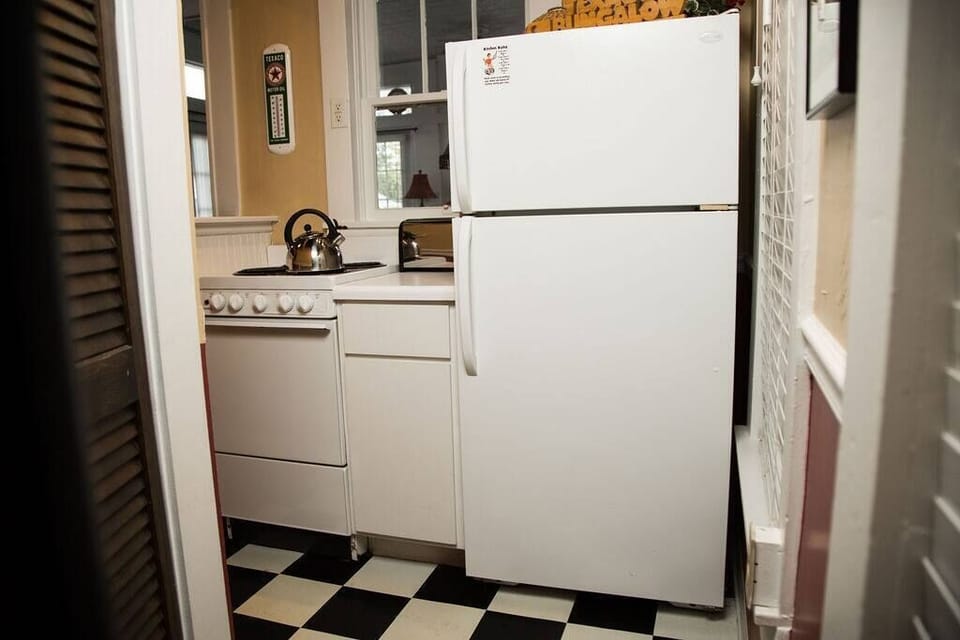 This kitchen is well-equipped with everything you might need to cook a meal.