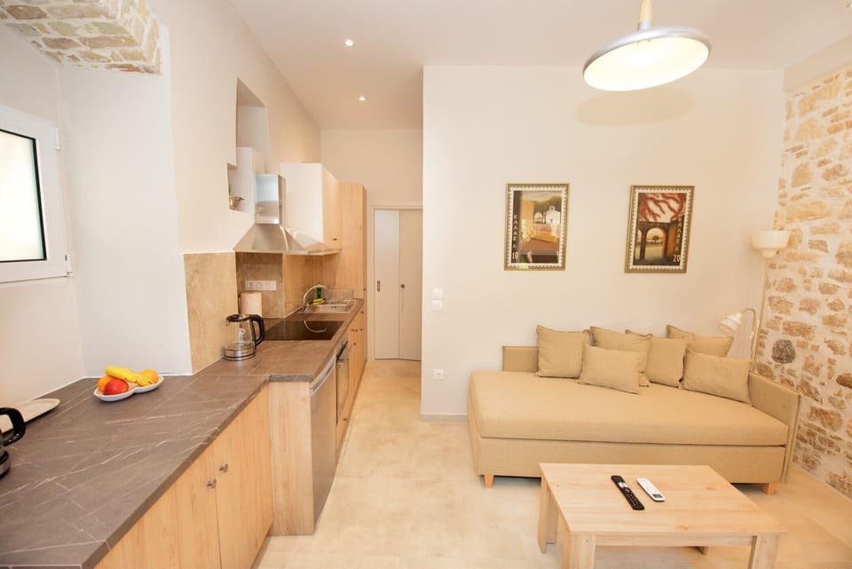 Deluxe Apartment | Living area | 40-inch Smart TV with cable channels