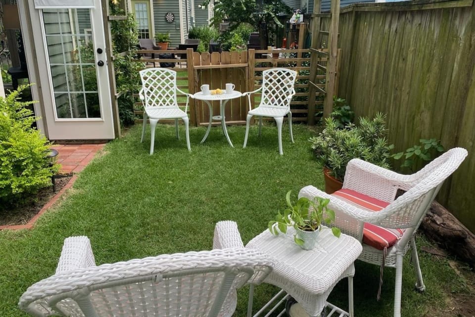 Private garden opens to larger cottage garden