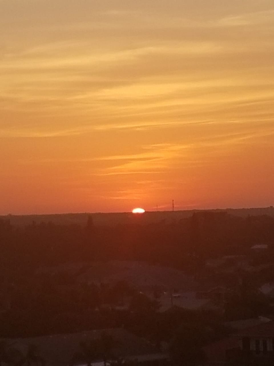 Sunset from front of building overlooking city