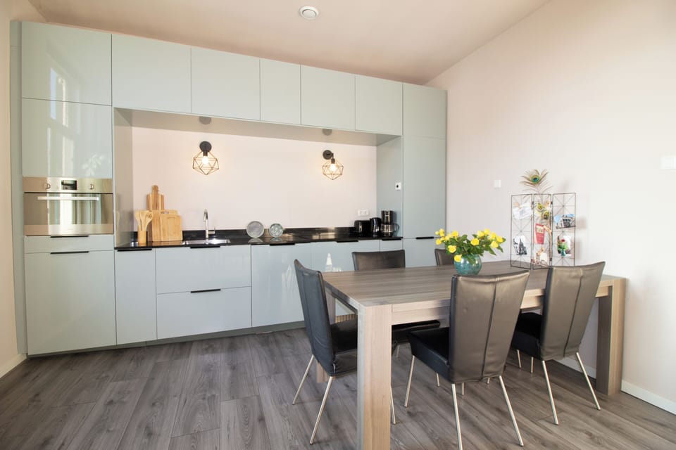 The dining table seats five for a relaxed meal or family game nights. 
