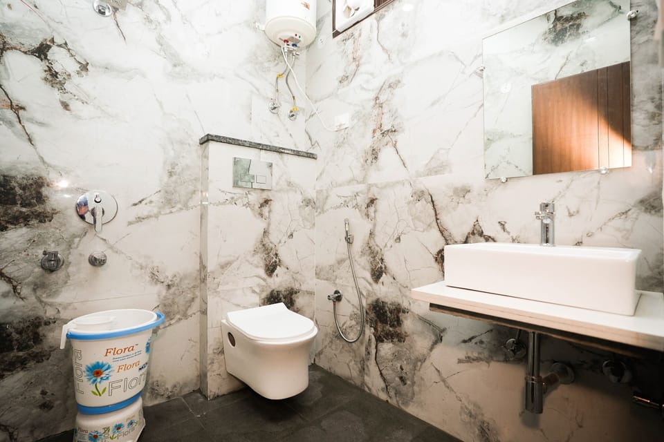 Separate tub and shower, rainfall showerhead, free toiletries, towels