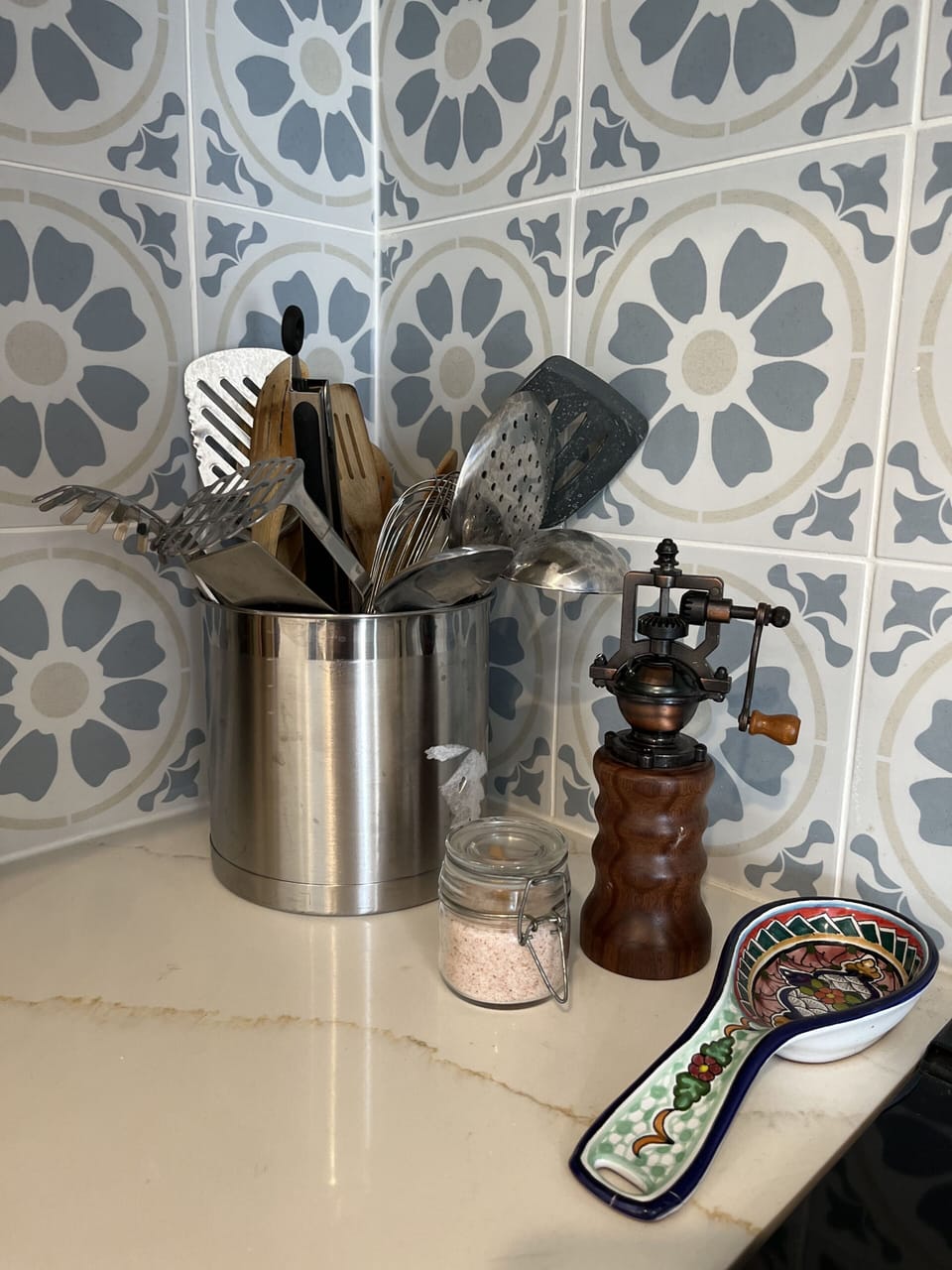 Fully stocked with cooking utensils.