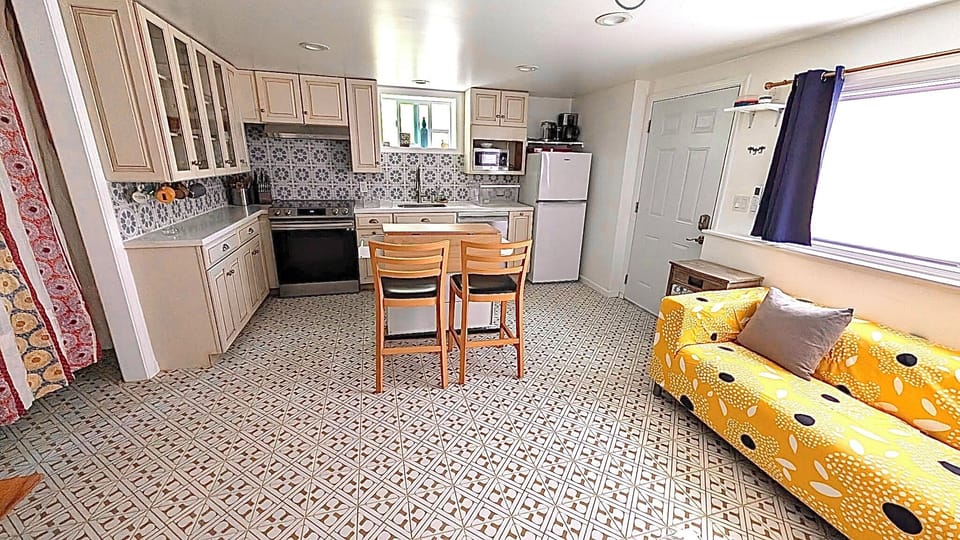 Kitchen counter seating and sitting area and projector tv viewing.