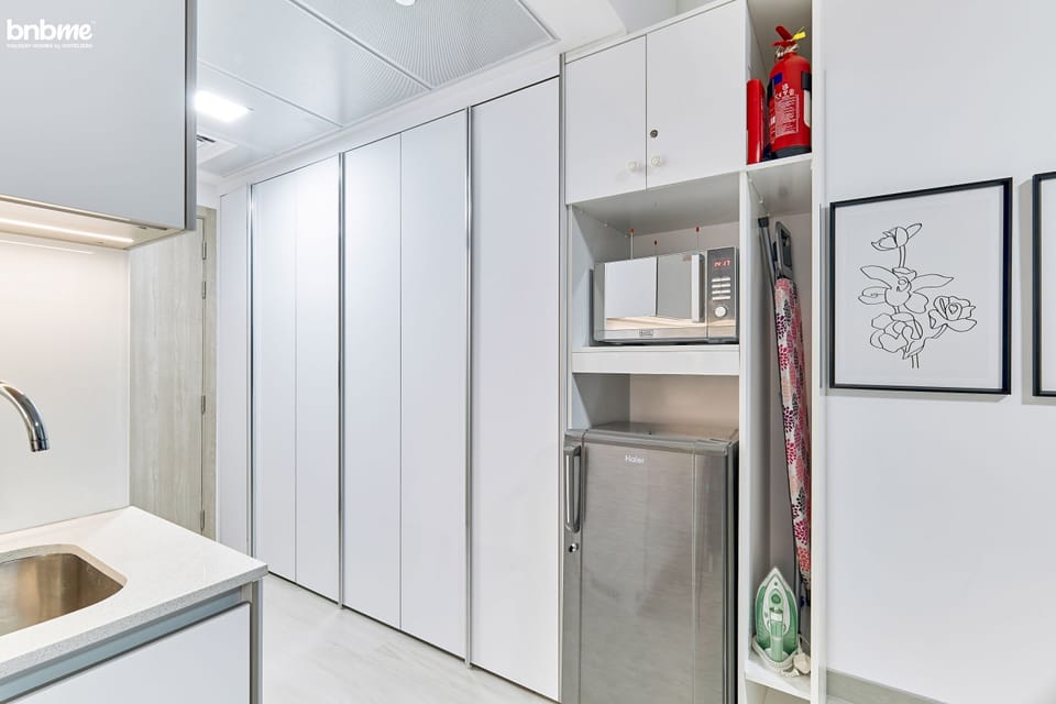 Apartment | Private kitchen | Electric kettle, dining tables