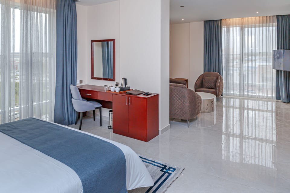 Junior Suite | Hypo-allergenic bedding available, down comforters, in-room safe, desk