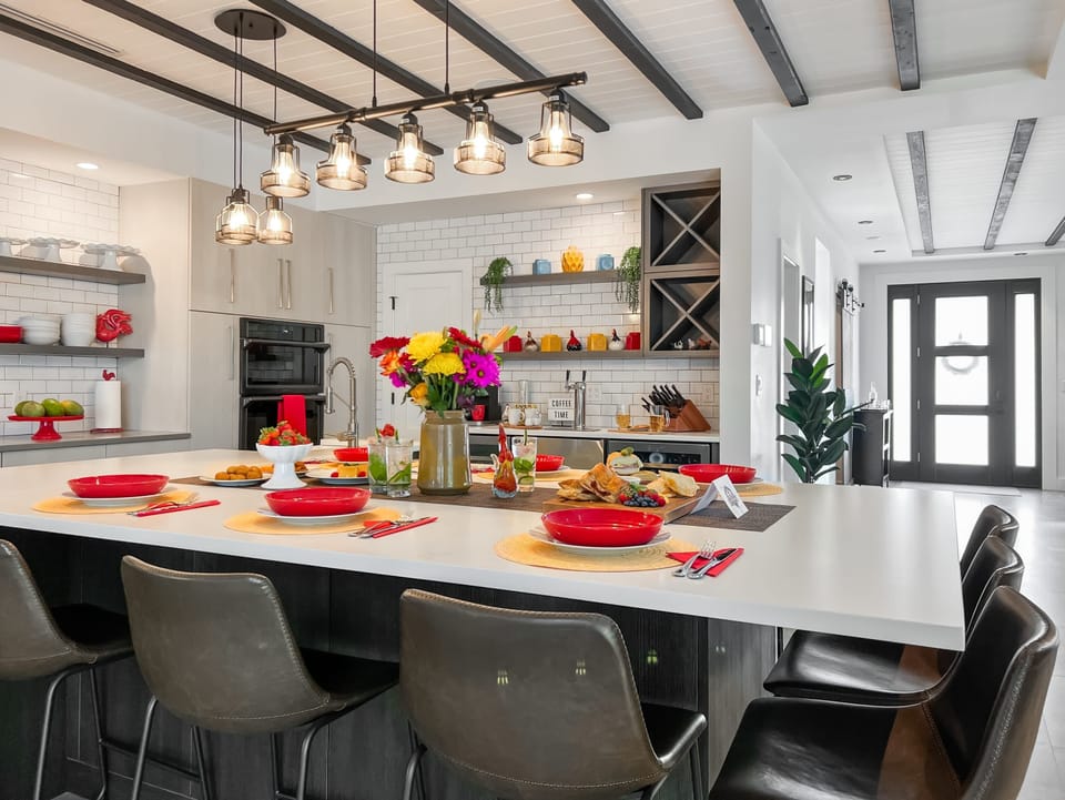 The kitchen island dining table offers up seating for 9.