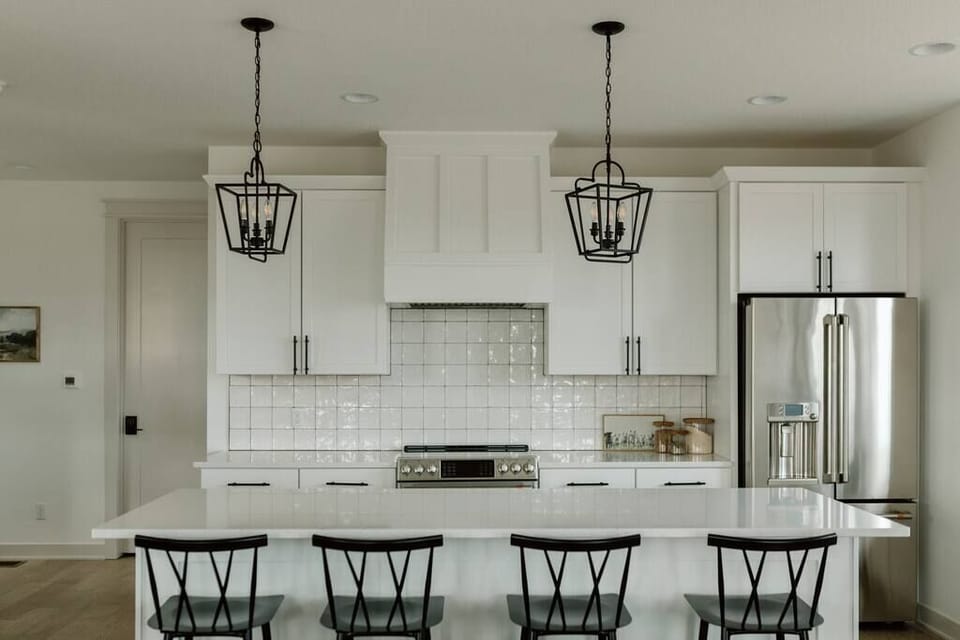 Level 1: Gourmet Kitchen Featuring GE Cafe Appliances and Electric Stove