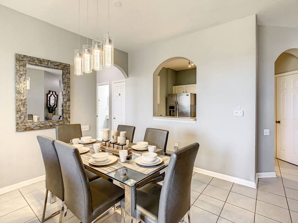 Enjoy meals with a view in this cozy, stylish dining area. Perfect for family dinners or entertaining guests!