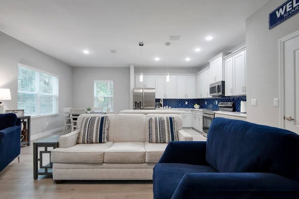 Both natural light and excellent lighting contribute to a bright and inviting living room.