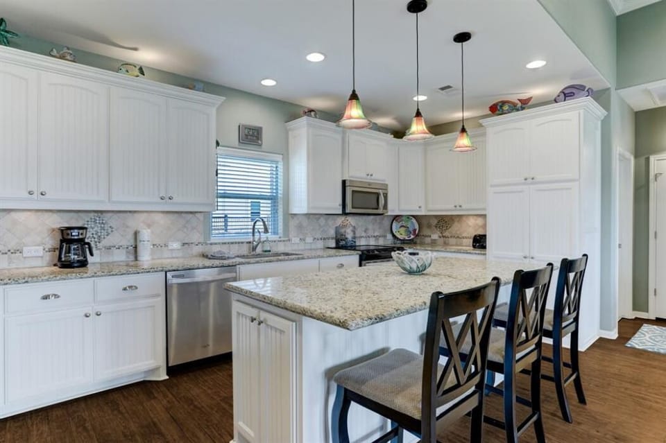 Large center island with seating for breakfast. 