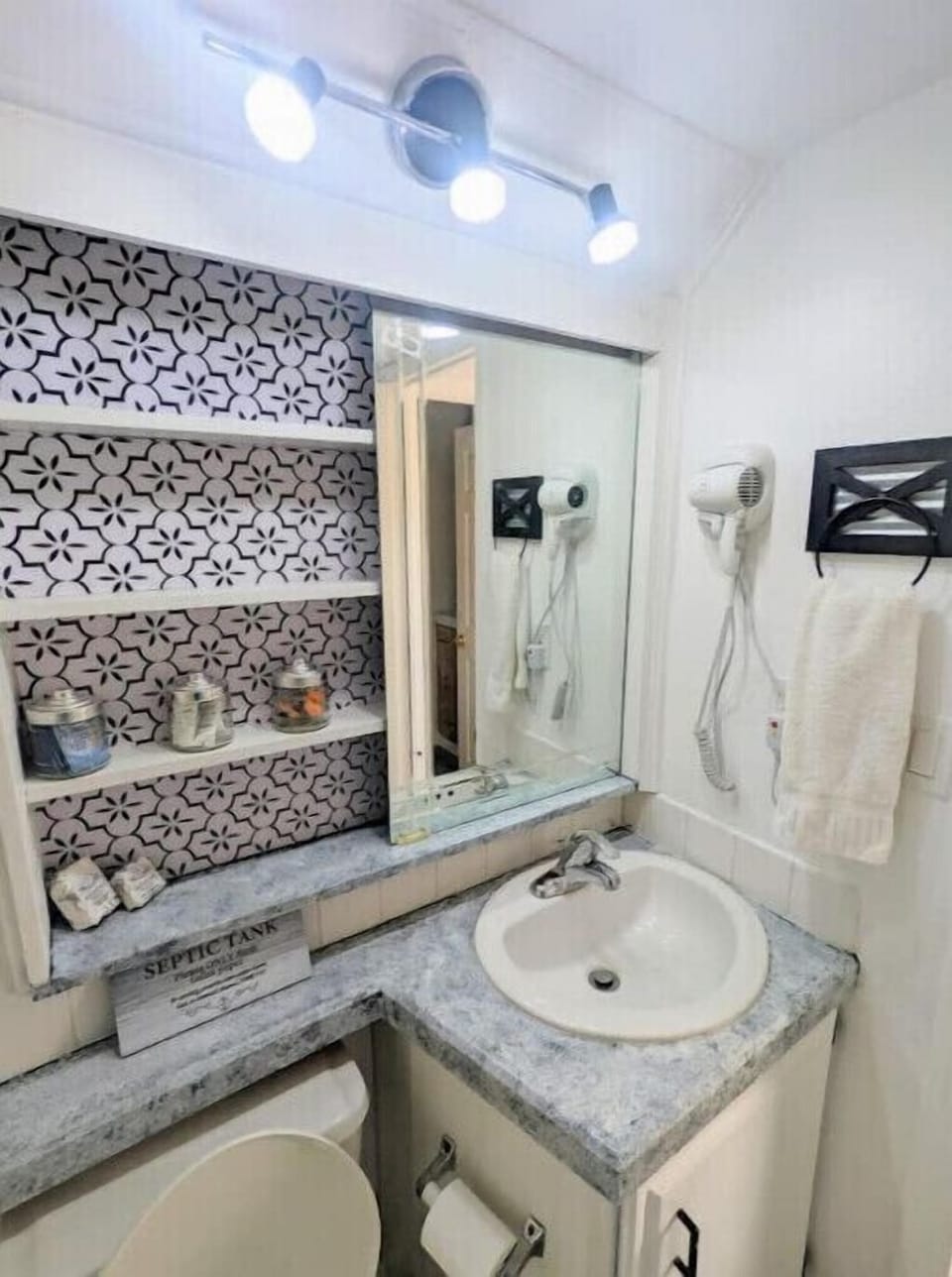 Bathroom is stocked with towels and toiletries 