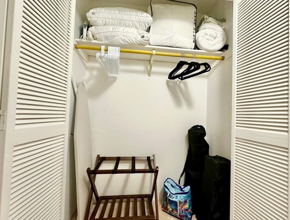 closet with extra bedding