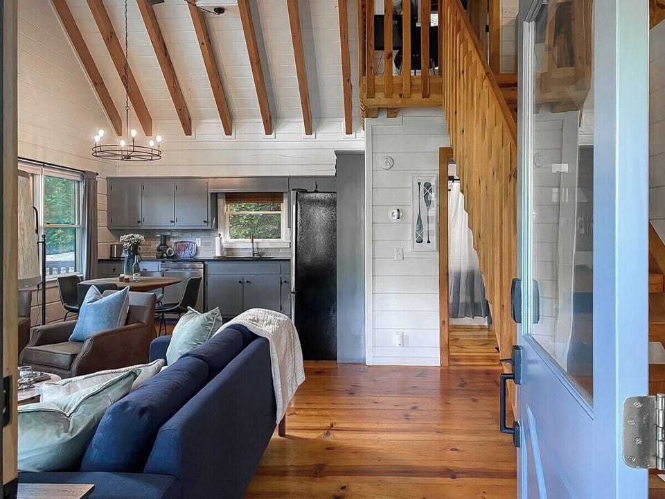 Next, head inside to our vaulted and airy living room…
