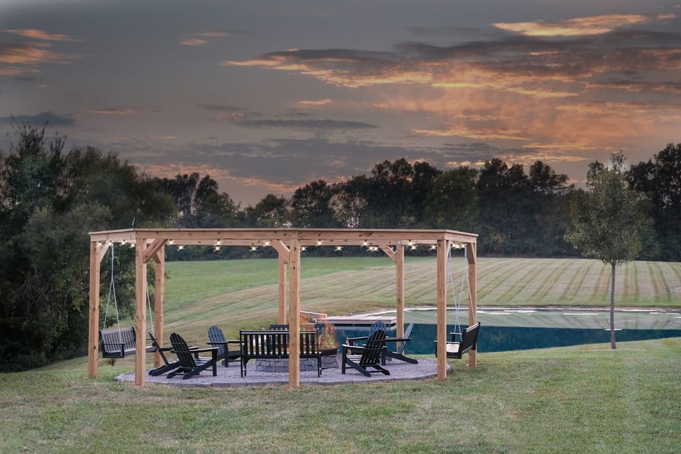 Outdoor gathering space and firepit at this Bardstown cabin rental, ideal for family getaways and bourbon weekends