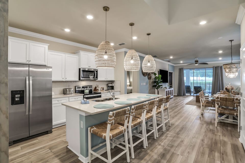 “Fully equipped kitchen & bar seating— perfect for family meals after Disney.