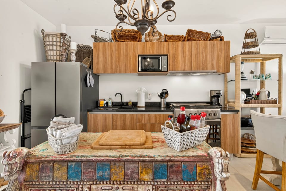 Fully equipped kitchen with modern appliances, ample counter space, and everything you need to cook.