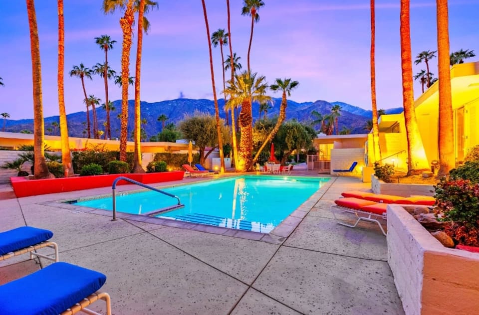 A sparkling communal pool and stunning mountain views awaits.