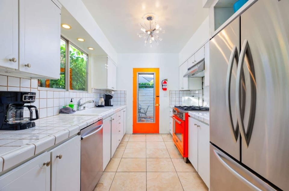 Kitchen offers direct outdoor access. 