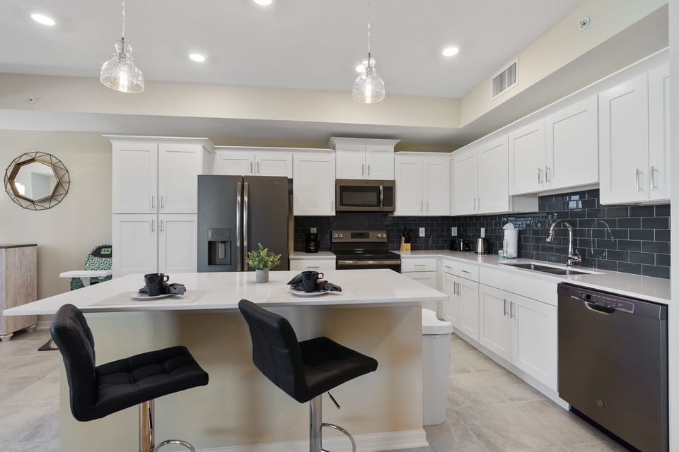 Kitchen featuring a convenient breakfast bar, offering a stylish and casual dining space for quick meals or socializing while preparing food